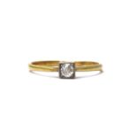 A gold single stone diamond ring,