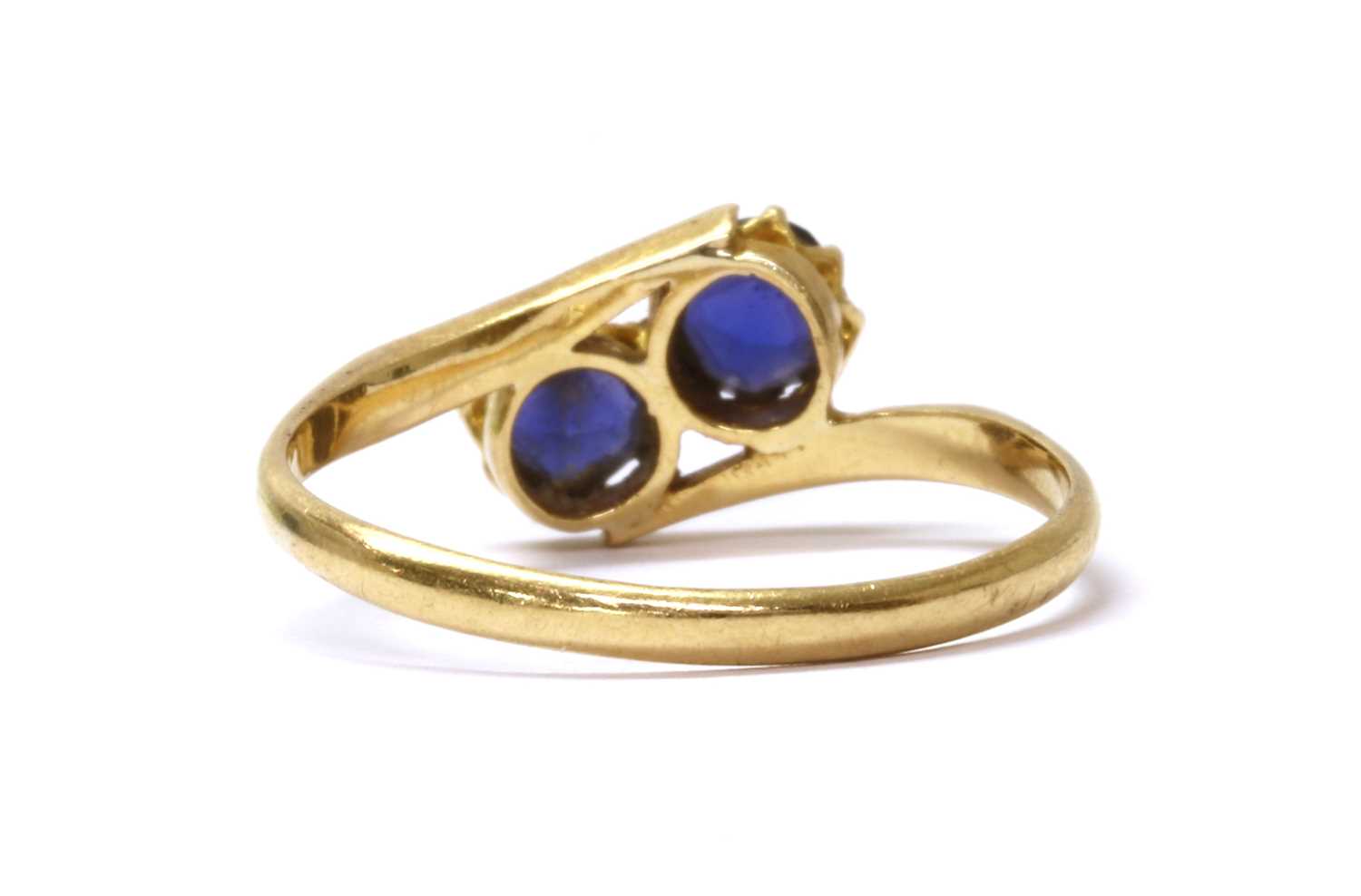 A gold two stone doublet crossover ring, - Image 3 of 3
