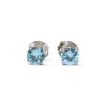 A pair of white gold blue zircon stud earrings,