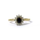 A 9ct gold sapphire and diamond cluster ring,