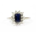 A white gold sapphire and diamond cluster ring,