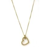 An 18ct gold diamond heart pendant,