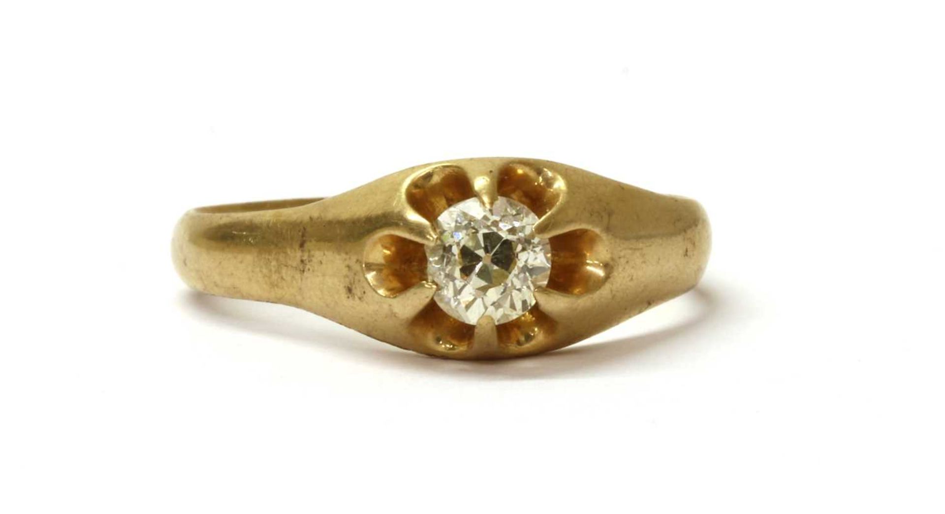 A gold single stone diamond ring,