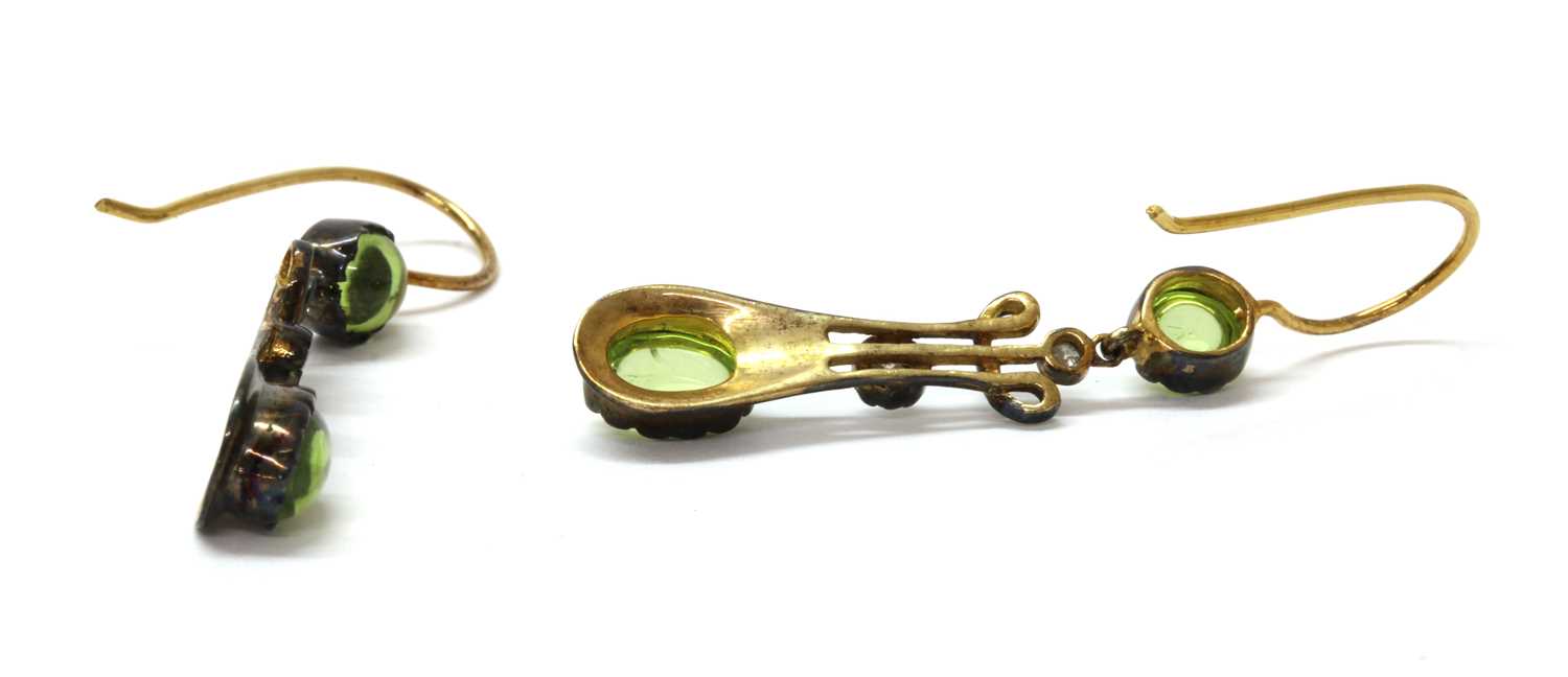 A pair of silver and gold, peridot and diamond drop earrings, - Image 2 of 2