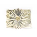 A silver daisy torque cuff bangle, by Tiffany & Co.,