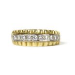 A gold diamond half eternity ring,