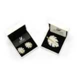 A Swarovski gilt metal leaf brooch and earrings suite,