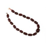 A single row cherry coloured Bakelite bead necklace,