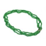 A three row uniform jade bead necklace,