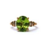 A 9ct gold peridot and diamond ring