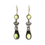 A pair of silver and gold, peridot and diamond drop earrings,