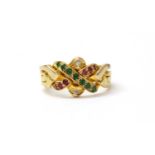 A gold emerald. ruby and diamond set puzzle ring,