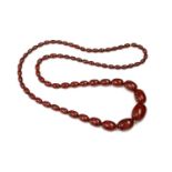 A cherry coloured Bakelite bead necklace,