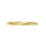 An Italian gold hollow hinged oval bangle,