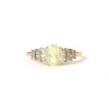 A gold opal and diamond ring,