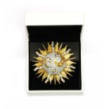 A Swarovski gilt metal celestial brooch,