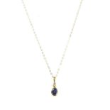 A gold tanzanite and diamond pendant,