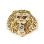 A gold lion head ring,