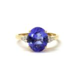 An 18ct gold tanzanite and diamond ring,