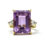 An 18ct gold amethyst and diamond three stone ring,