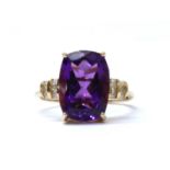 A gold amethyst and diamond ring,