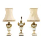 A pair of Classical style white marble and gilt metal urn form table lamps,