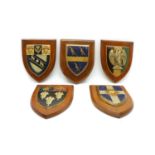 A collection of twelve heraldic plaques,