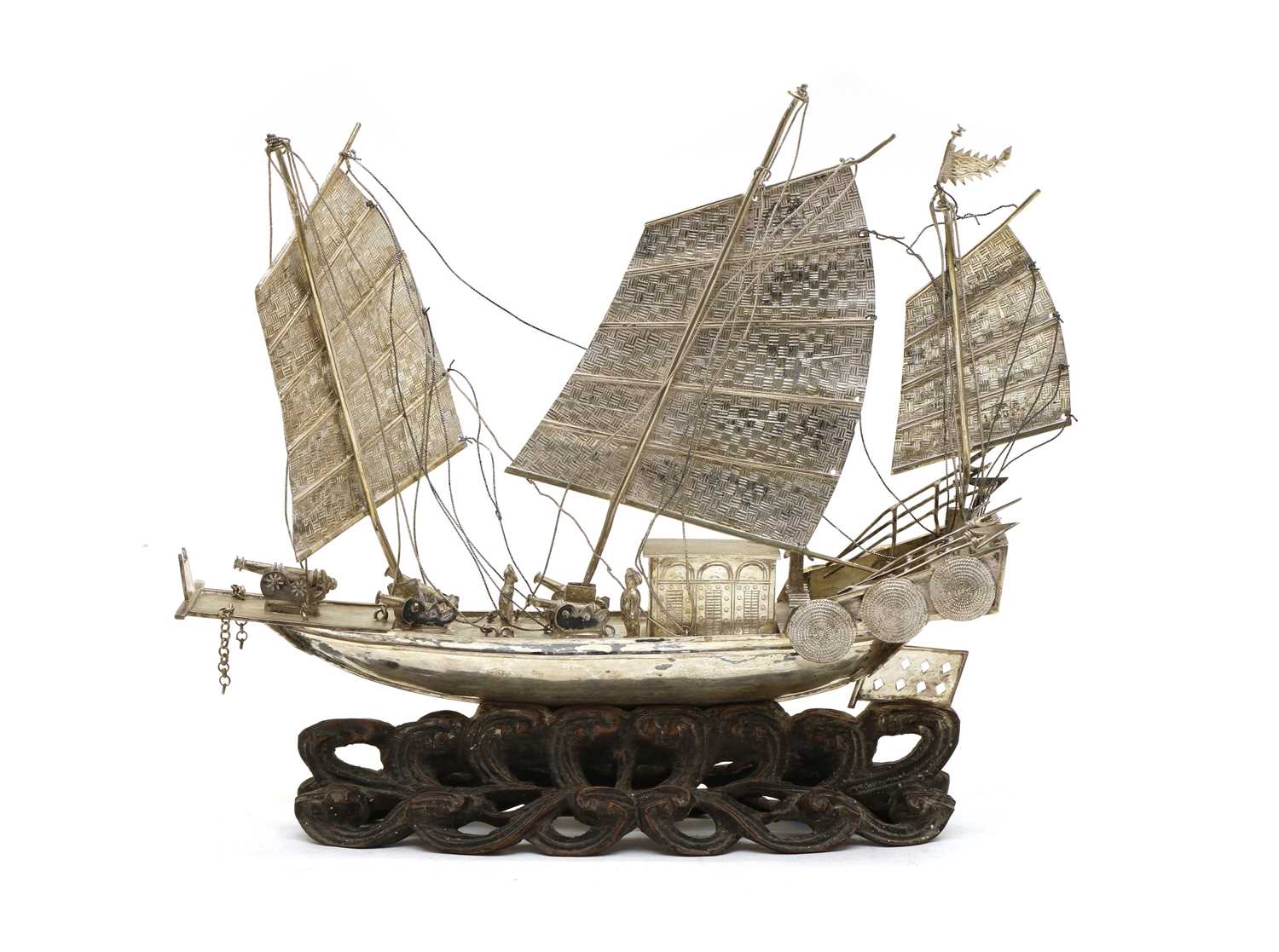 A Chinese export white metal model of a junk,