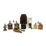 A rustic walnut and iron moulin or coffee grinder,