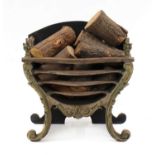 A George III style cast iron and brass mounted fire grate,