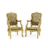 A pair of French Regence-style giltwood fauteuils
