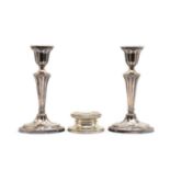 A pair of silver candlesticks,