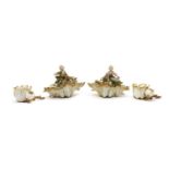 A pair of Continental porcelain shell form cache dishes,