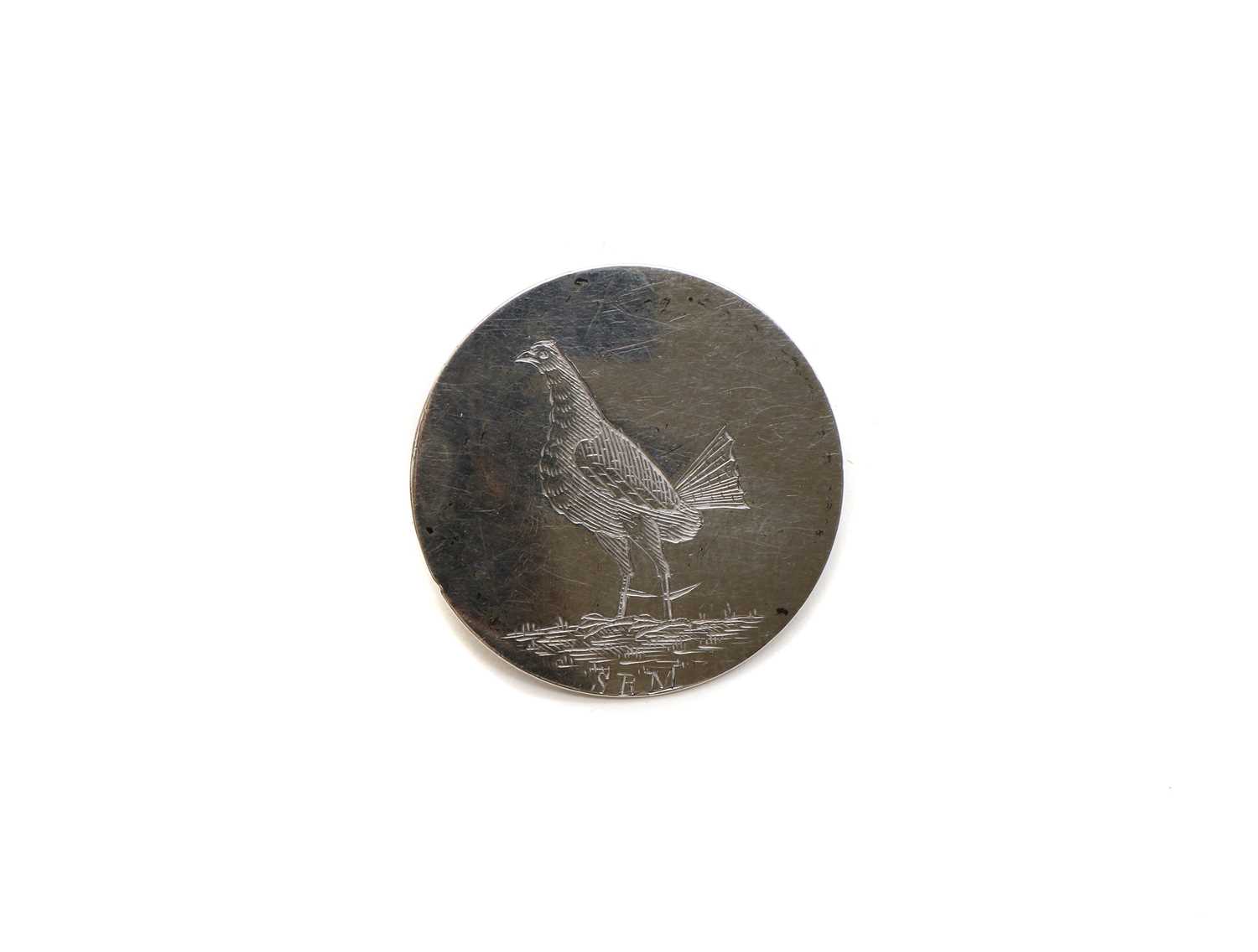 A silver cockfighting button