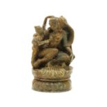 A soapstone carving of a Bodhisattva with child,