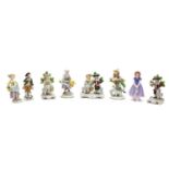 A collection of seven Sitzendorf porcelain figures,