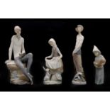 A group of four Lladro figures,