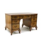 A George III style walnut pedestal desk,