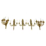 A pair of gilt-bronze three-branch wall lights,