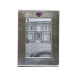 An Art Deco hammered pewter easel backed photograph frame,