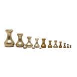 A composed set of ten brass bell weights,
