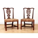 A pair of Chippendale period mahogany single chairs