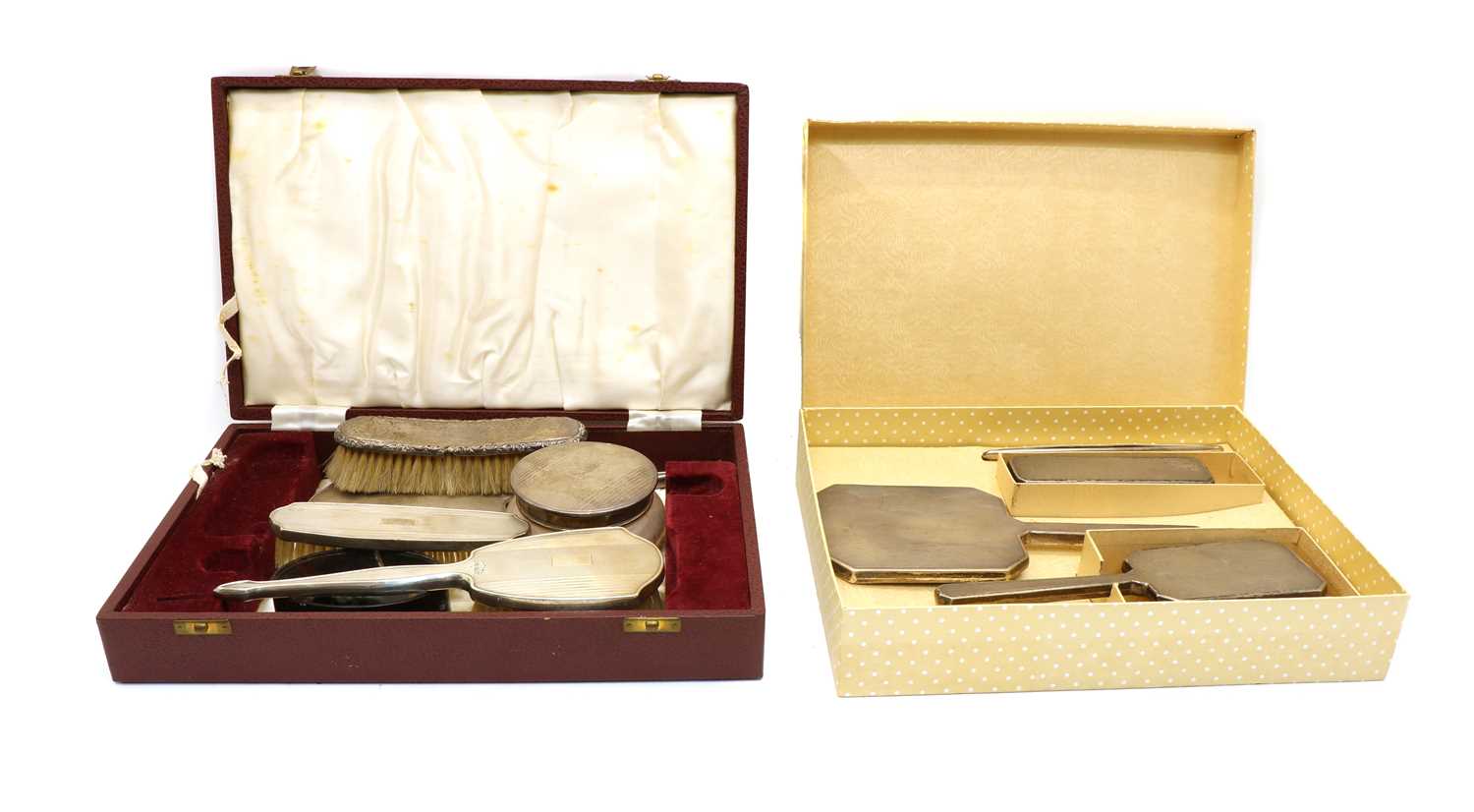 A cased silver dressing table set,