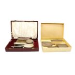 A cased silver dressing table set,