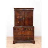 A walnut and feather-banded cabinet on chest,
