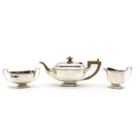 A silver three piece tea service,