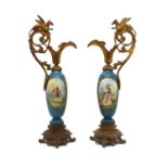 A pair of single handled Sèvres style vases,