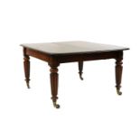 A late Regency mahogany extending dining table in the manner of Gillow,