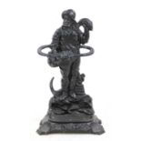 A cast-iron stick stand in the form of a fisherman,