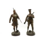 Fugere, a pair of patinated spelter figures,